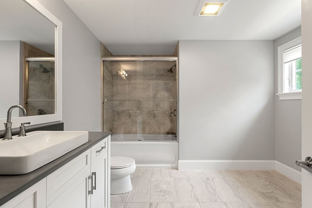 1663 Lowell Road Concord, MA 01742 - Photo 24 of 41 a bathroom with a sink a toilet and shower