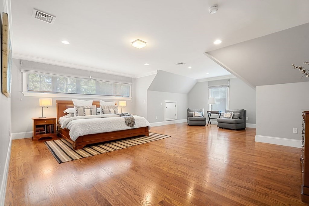 1663 Lowell Road Concord, MA 01742 - Photo 26 of 41 a bedroom with furniture and a wooden floor