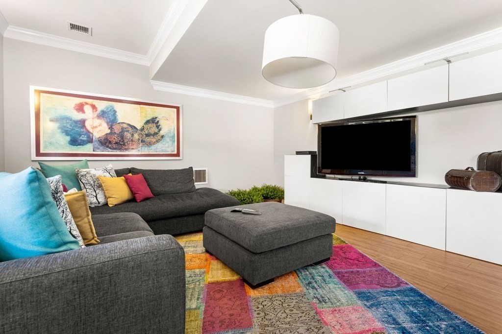 1663 Lowell Road Concord, MA 01742 - Photo 34 of 41 a living room with furniture and a flat screen tv