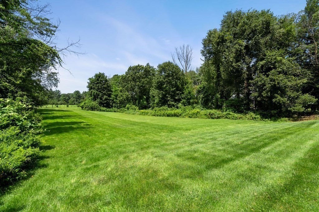 1663 Lowell Road Concord, MA 01742 - Photo 36 of 41 a view of a grassy field with trees