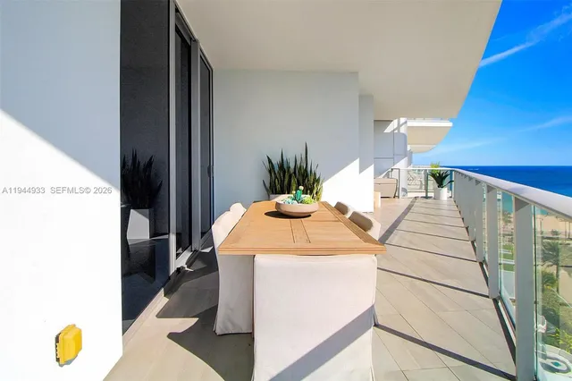 a large kitchen with kitchen island a sink stainless steel appliances and cabinets