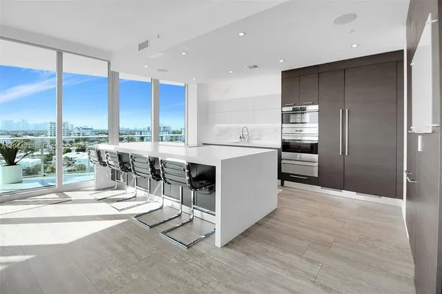 a large kitchen with a large window