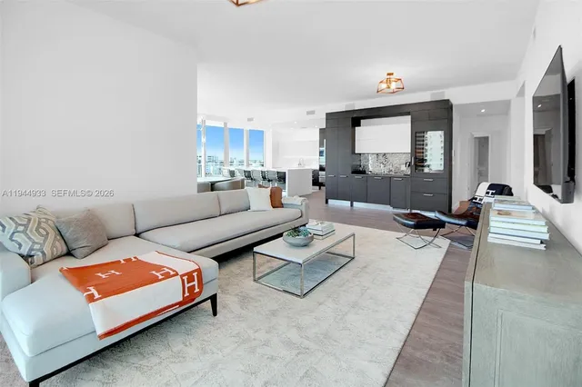 a view of a garden with buildings in the background