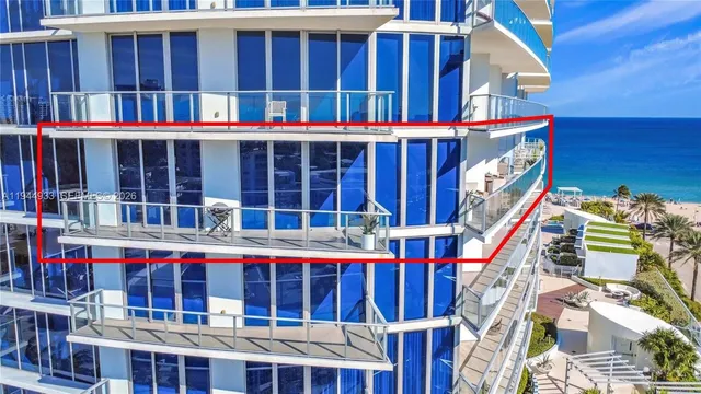 a view of a large building with a small yard