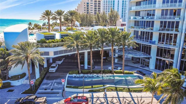 a view of a hallway with paintings on the wall