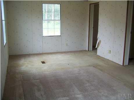 1901 Stacey Road Cantonment, FL 32533 - Photo 7 of 17 an empty room with a window