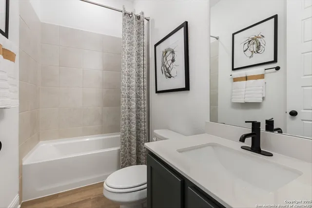 a bathroom with a sink a toilet and a bathtub