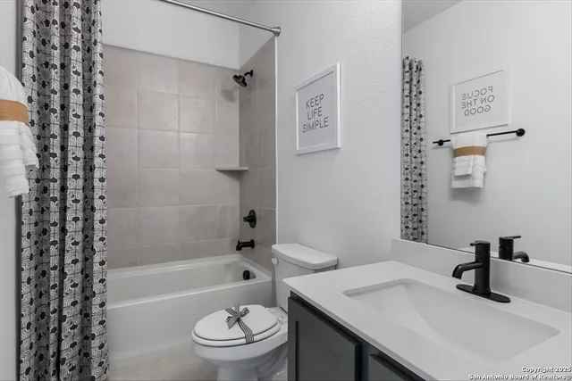 a bedroom with a bed and a table