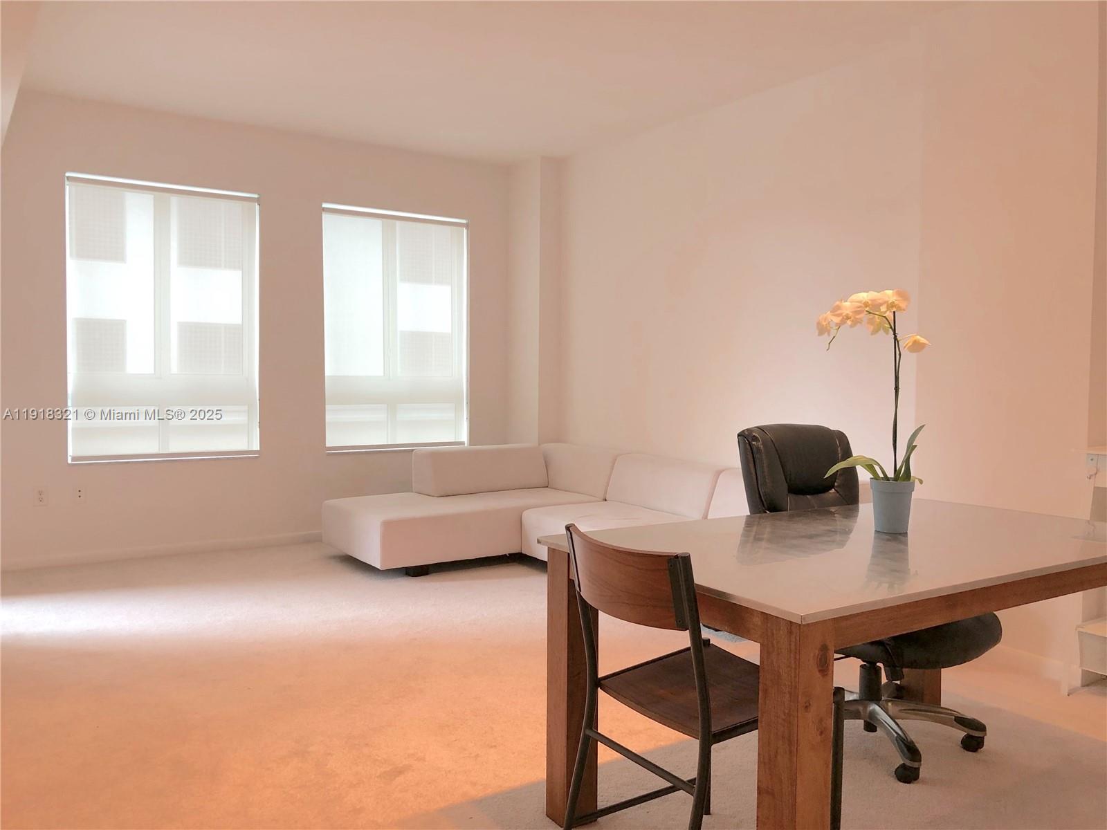 7350 Southwest 89th Street, Unit 408S Miami, FL 33156 - Photo 3 of 19 a living room with furniture and a window