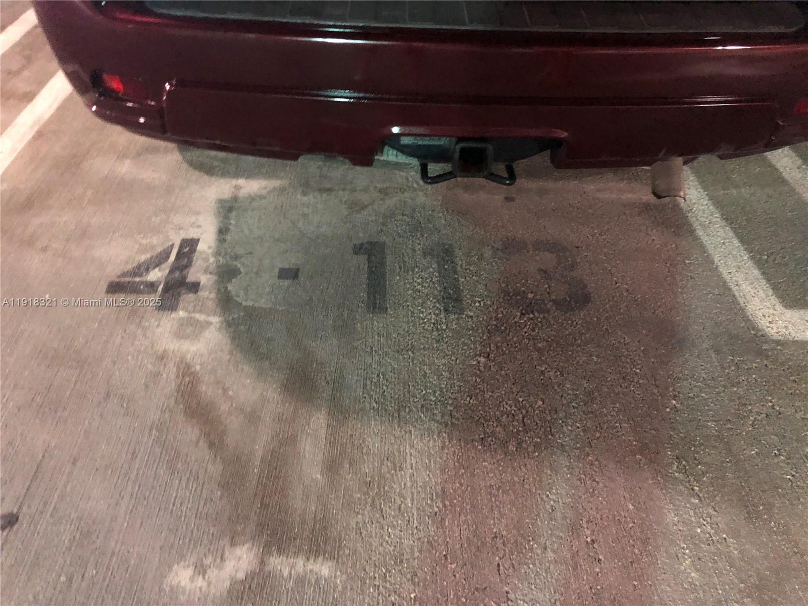 7350 Southwest 89th Street, Unit 408S Miami, FL 33156 - Photo 10 of 19 a view of a room with water heater and wooden cabinets