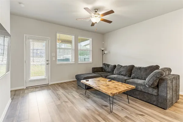 a living room with furniture and a large window