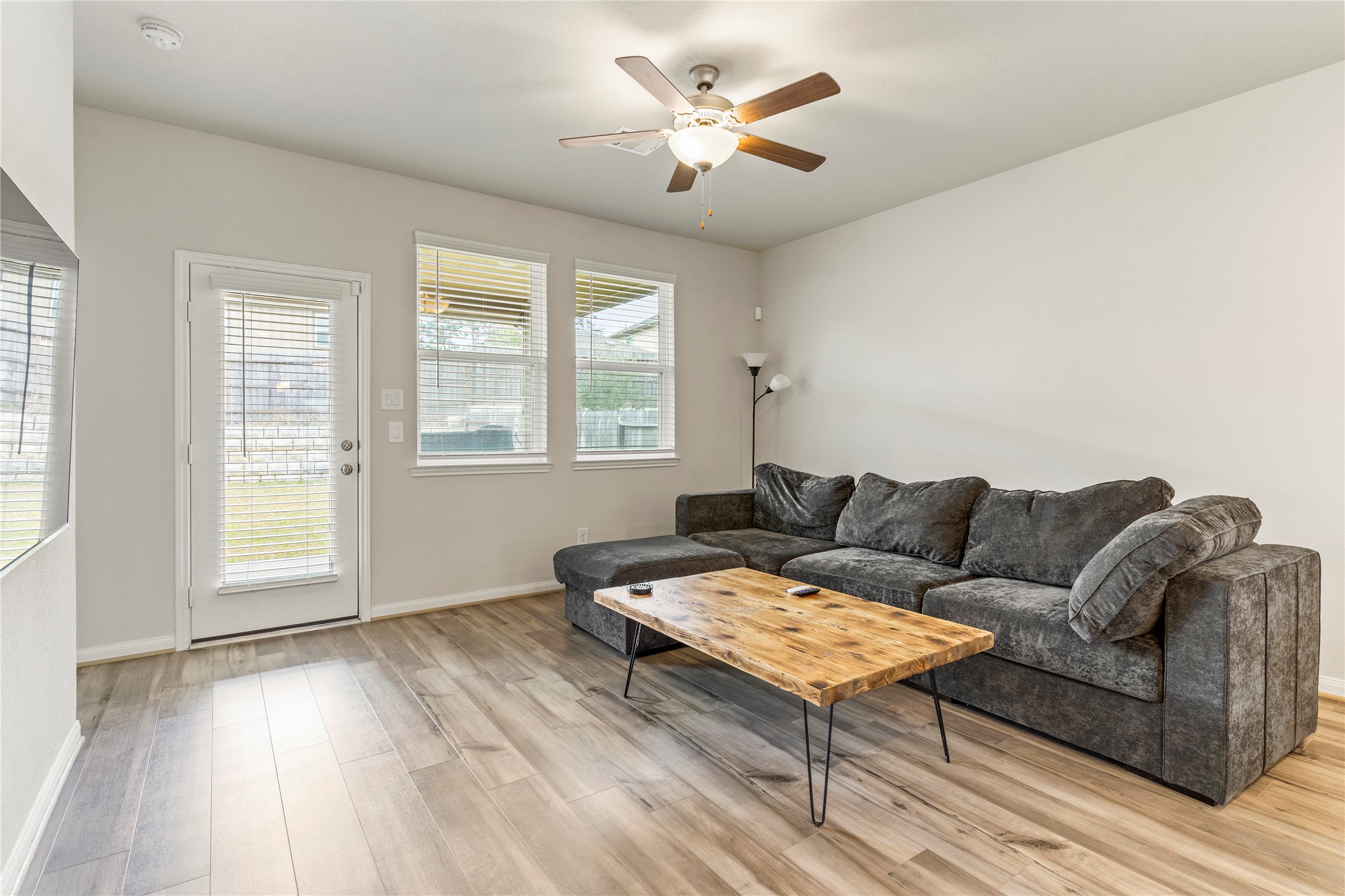2019 Myrtle Oak Street Conroe, TX 77304 - Photo 11 of 23 a living room with furniture and a large window