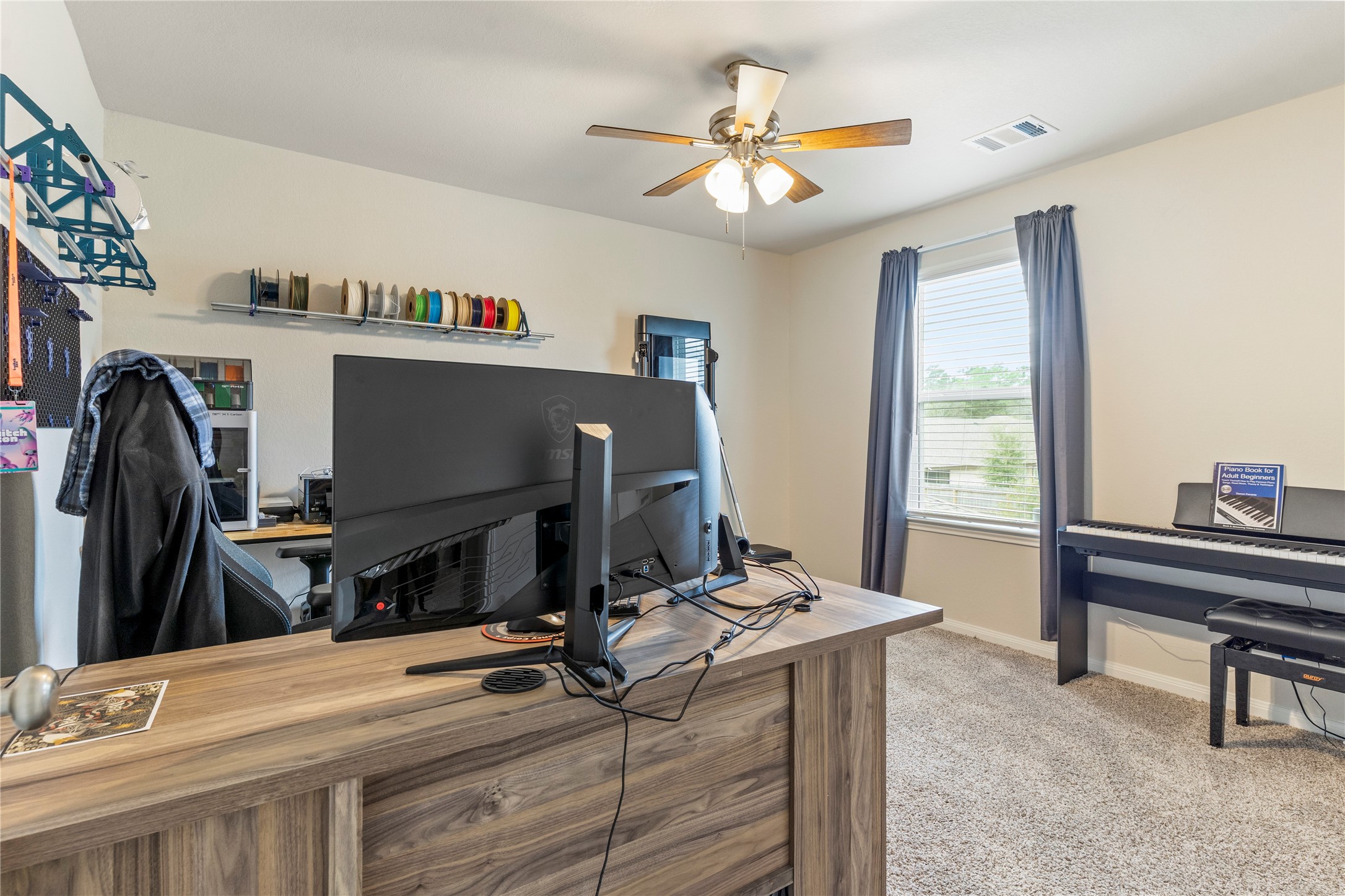 2019 Myrtle Oak Street Conroe, TX 77304 - Photo 17 of 23 a room with furniture a flat screen tv and a window