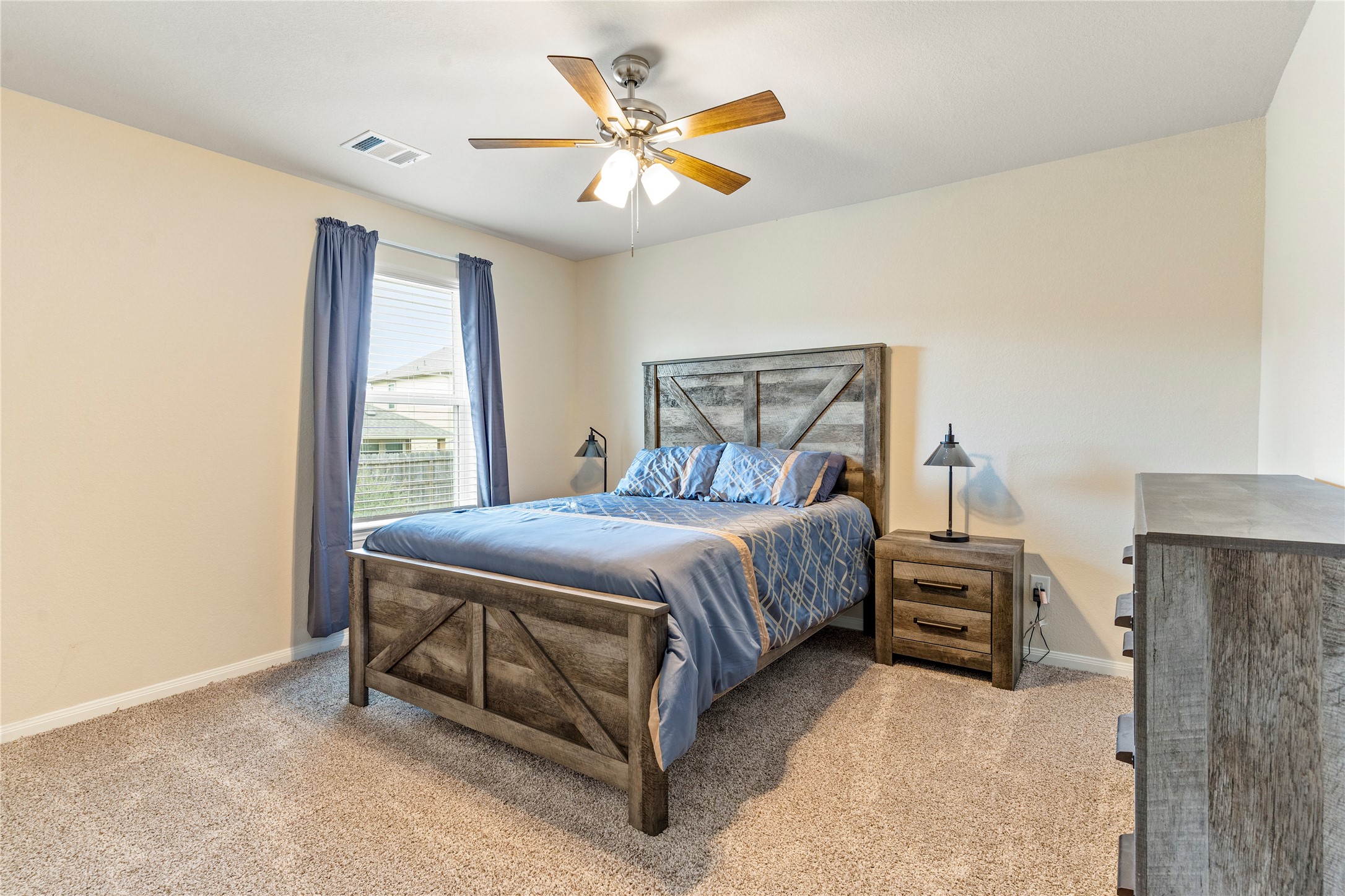 2019 Myrtle Oak Street Conroe, TX 77304 - Photo 19 of 23 a bedroom with a bed and window