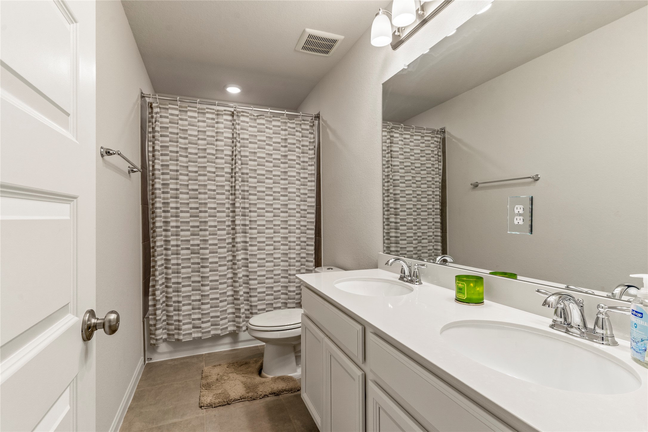 2019 Myrtle Oak Street Conroe, TX 77304 - Photo 20 of 23 a bathroom with a sink a toilet and shower