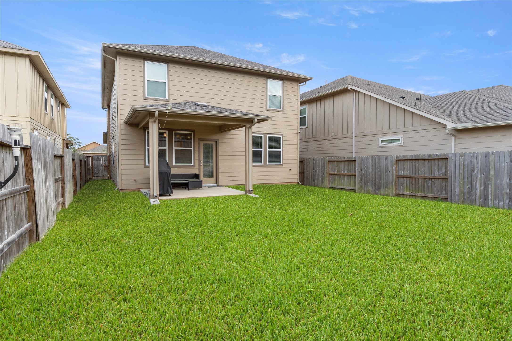 2019 Myrtle Oak Street Conroe, TX 77304 - Photo 22 of 23 a view of a house with a yard and porch