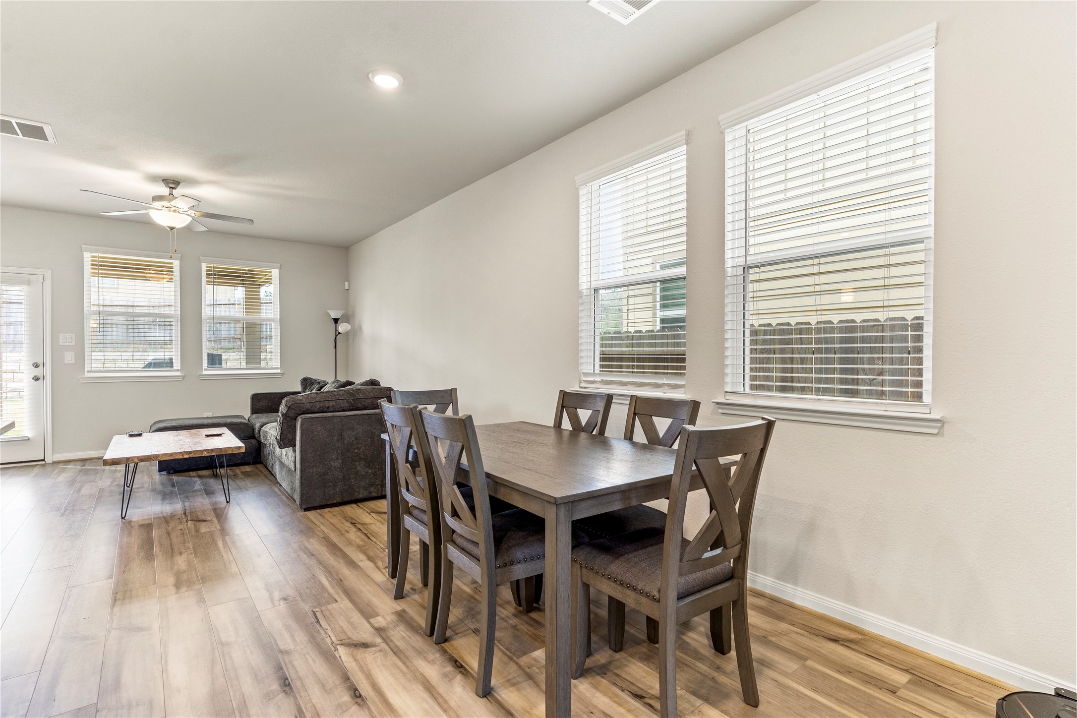 2019 Myrtle Oak Street Conroe, TX 77304 - Photo 6 of 23 a view of a dining room with furniture and wooden floor