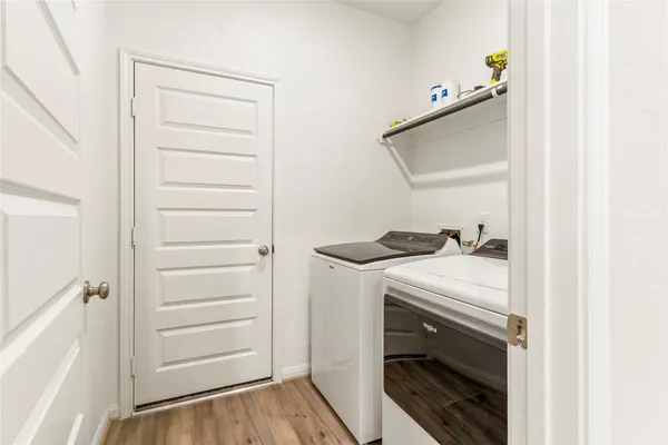 a utility room with washing machine
