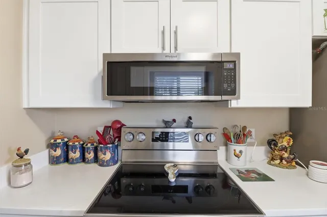 a kitchen with a stove and cabinets