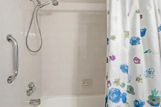 a bathroom with a shower curtain