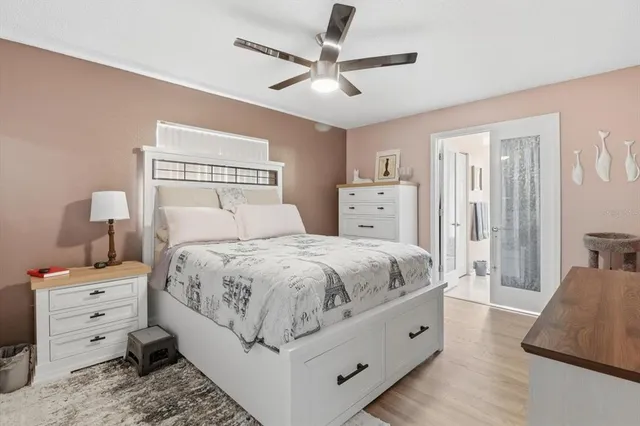 a spacious bedroom with a bed and a couch