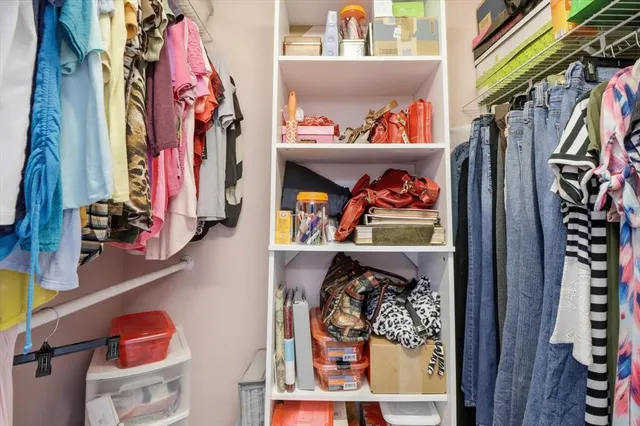 a living room with furniture a dining table and a large window