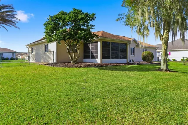 a front view of a house with a yard and porch