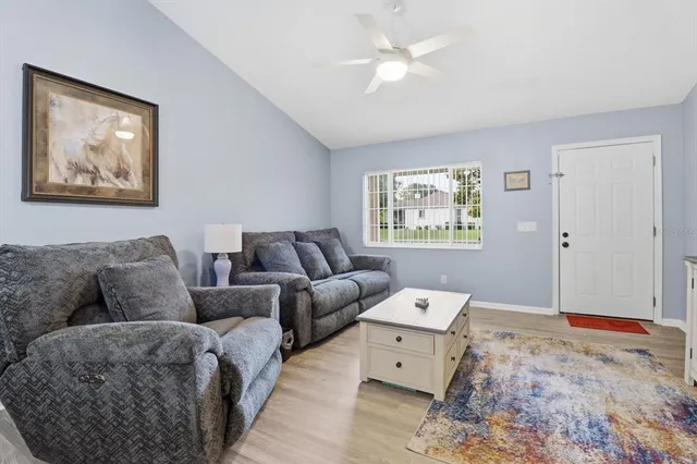 a living room with furniture and window