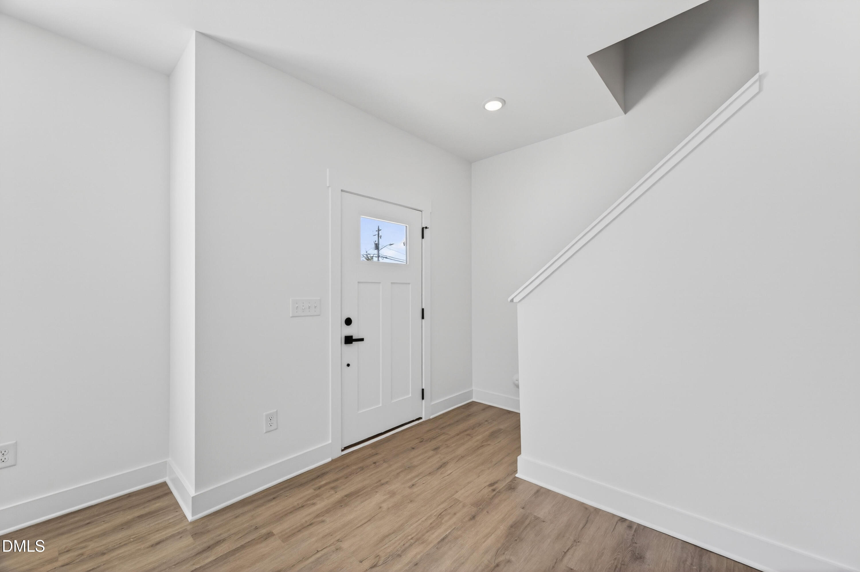 1196 Hurdle Mills Road Roxboro, NC 27573 - Photo 9 of 50 a view of an empty room with wooden floor