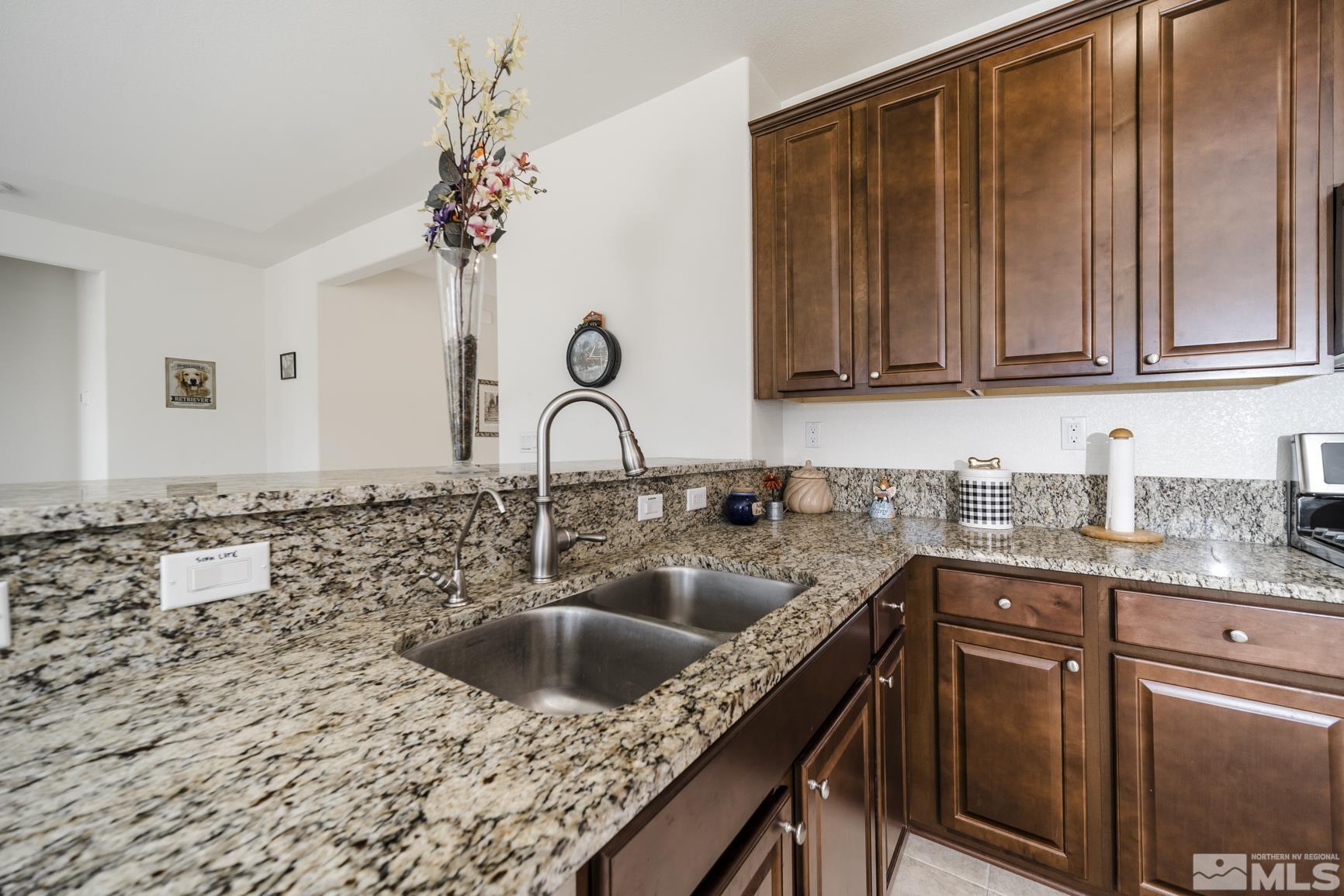6758 Eagle Peak Drive Carson City, NV 89701 - Photo 11 of 28 a kitchen with a sink and cabinets