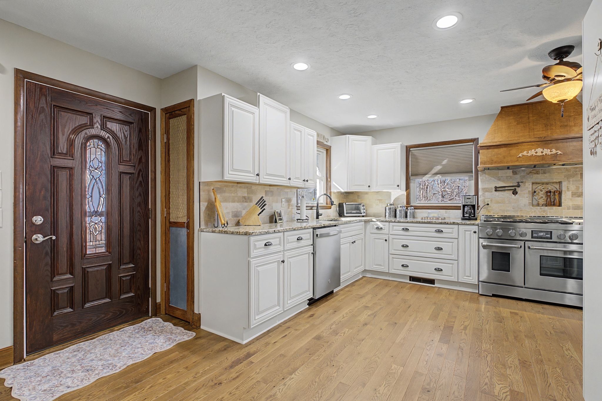 1231 Abiff Road Bon Aqua, TN 37025 - Photo 14 of 60 a kitchen with stainless steel appliances granite countertop a stove and a refrigerator