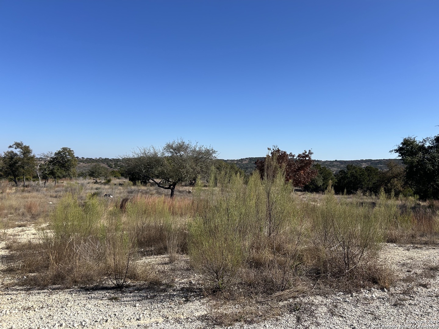 Lot 47 Ashtons Way Kerrville, TX 78028 - Photo 6 of 25 a view of a lake with a mountain in the background