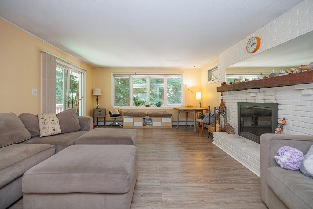 110 Chester Street Worcester, MA 01605 - Photo 11 of 19 a living room with furniture and a fireplace