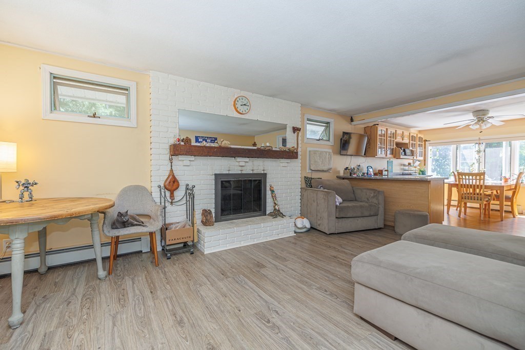 110 Chester Street Worcester, MA 01605 - Photo 12 of 19 a living room with furniture and a fireplace