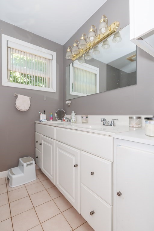 110 Chester Street Worcester, MA 01605 - Photo 13 of 19 a bathroom with a sink vanity and mirror