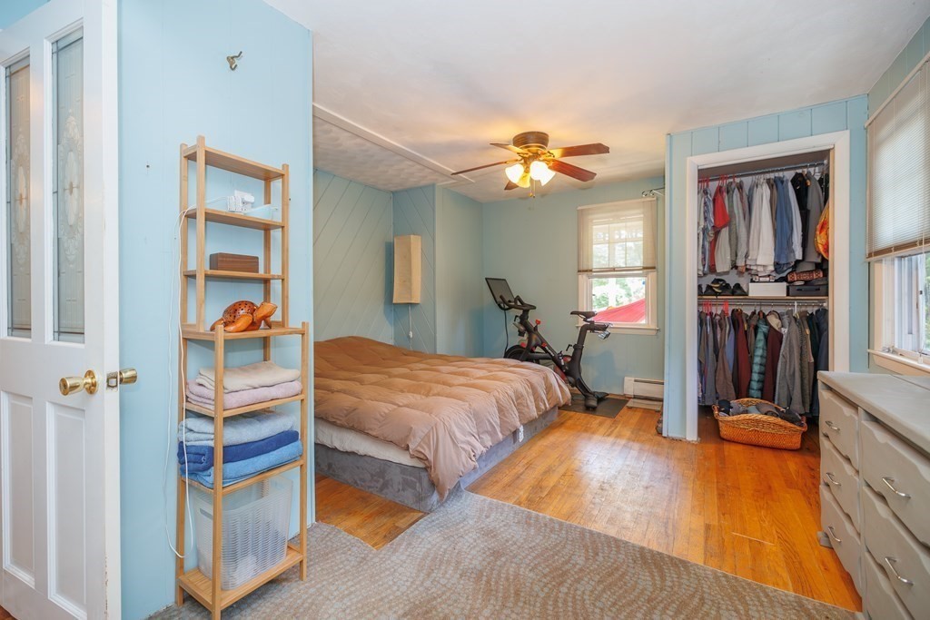 110 Chester Street Worcester, MA 01605 - Photo 14 of 19 a bedroom with bed and a chandelier