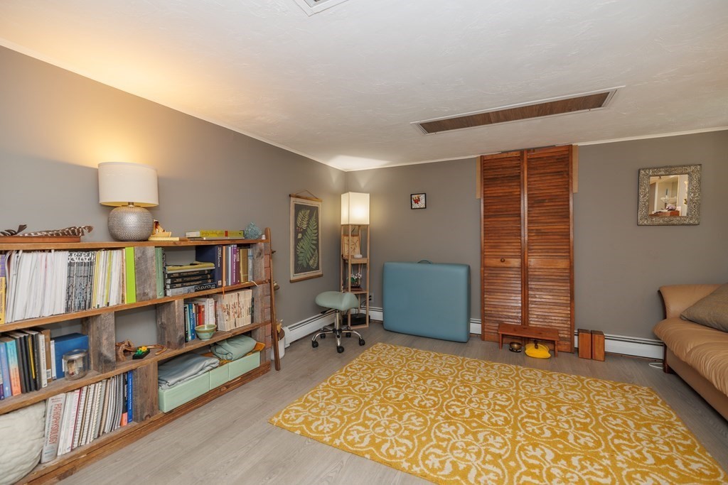 110 Chester Street Worcester, MA 01605 - Photo 17 of 19 a livingroom with a book shelf
