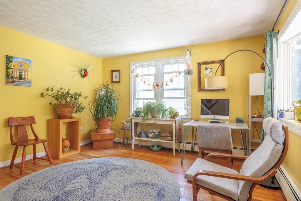 110 Chester Street Worcester, MA 01605 - Photo 4 of 19 a living room with furniture a flat screen tv and a large window