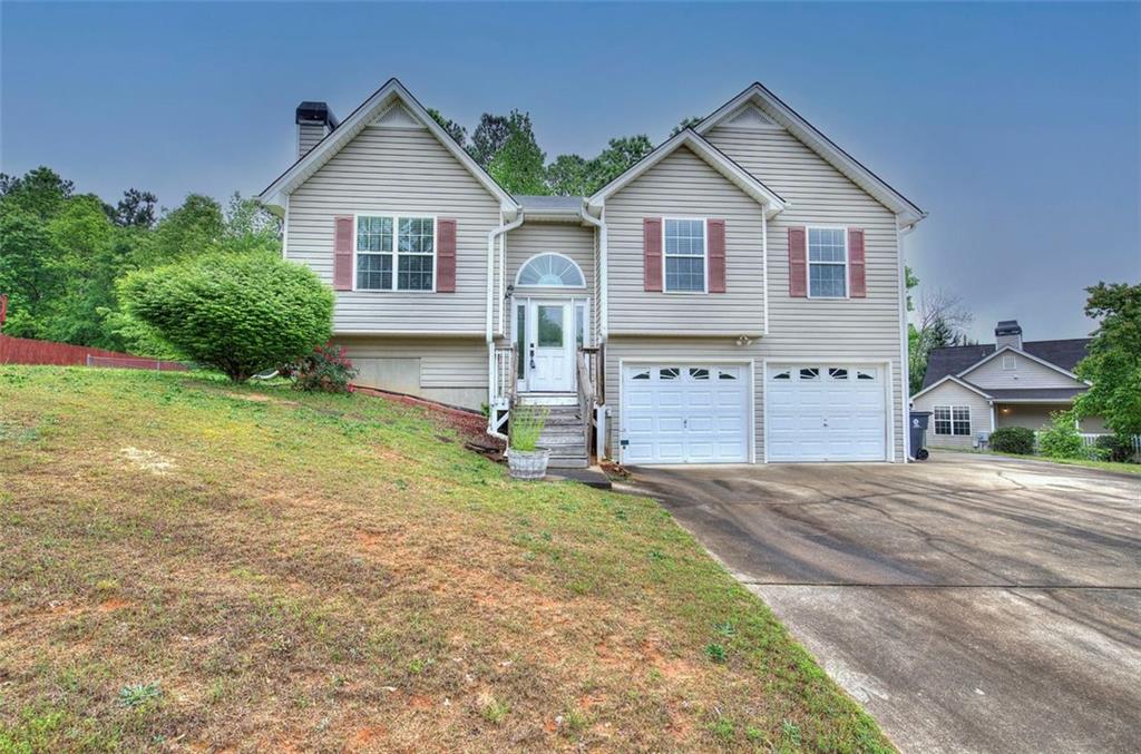219 Blue Springs Way Dallas, GA 30157 - Photo 1 of 1 a view of a house with backyard and garden