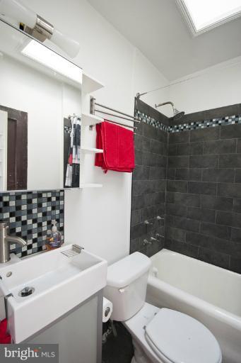 3629 Yolando Road Baltimore, MD 21218 - Photo 14 of 18 a bathroom with a toilet a sink and bathtub