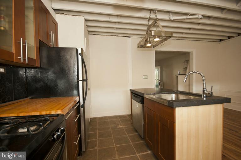 3629 Yolando Road Baltimore, MD 21218 - Photo 5 of 18 a kitchen with a stove and a refrigerator