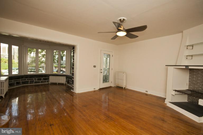 3629 Yolando Road Baltimore, MD 21218 - Photo 9 of 18 wooden floor in an empty room with a window