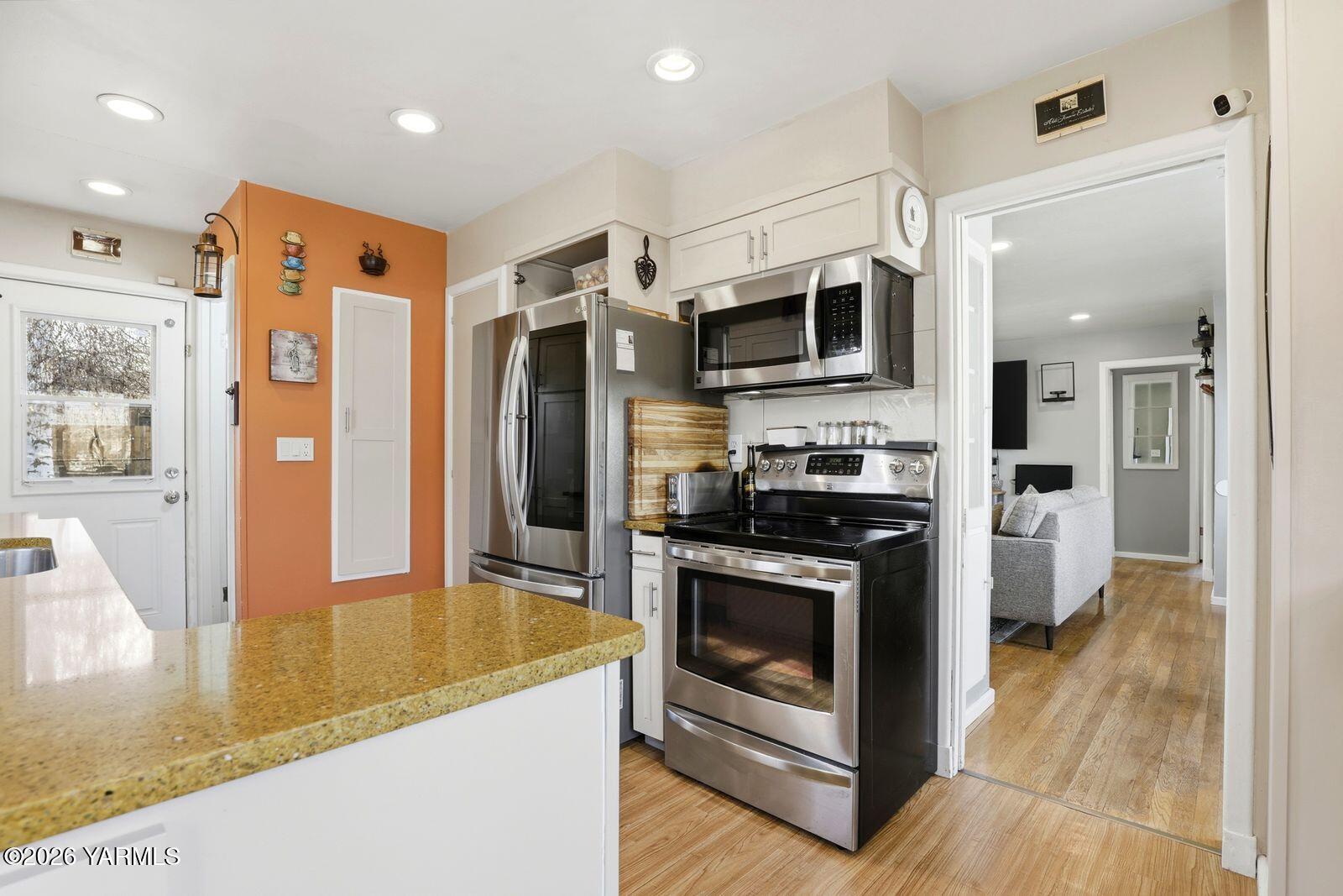 3208 Summitview Avenue Yakima, WA 98902 - Photo 11 of 26 a kitchen with stainless steel appliances granite countertop a refrigerator a stove and a sink