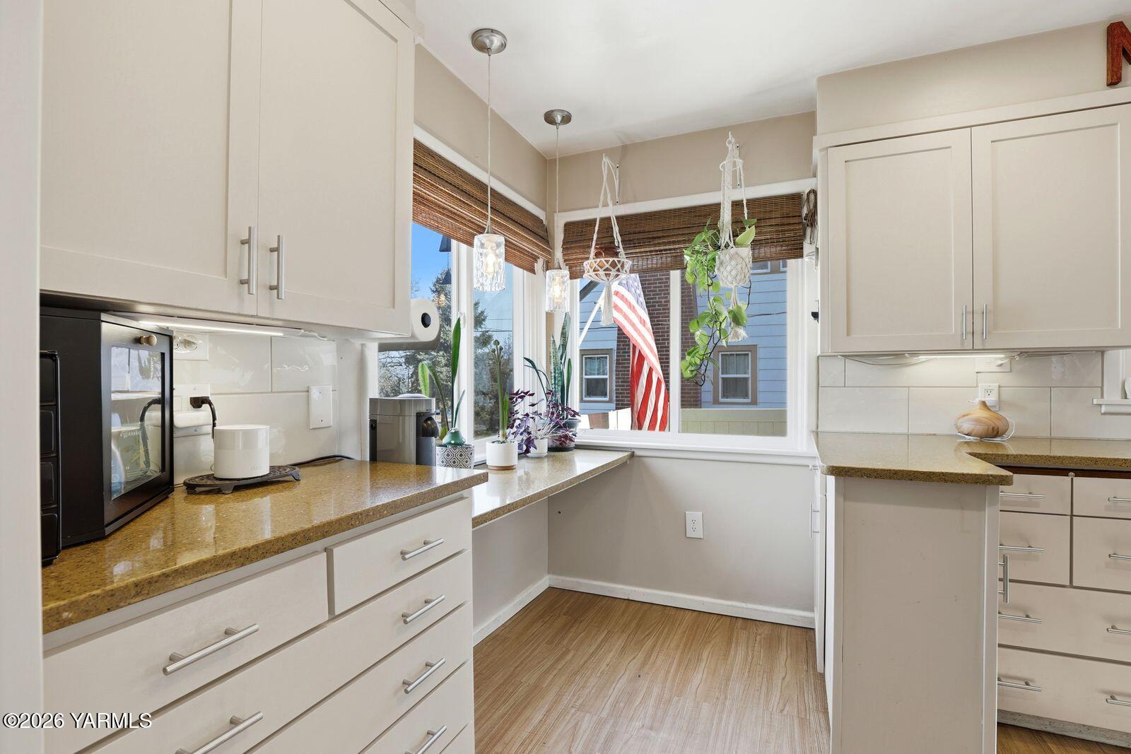 3208 Summitview Avenue Yakima, WA 98902 - Photo 12 of 26 a kitchen with a sink window and cabinets