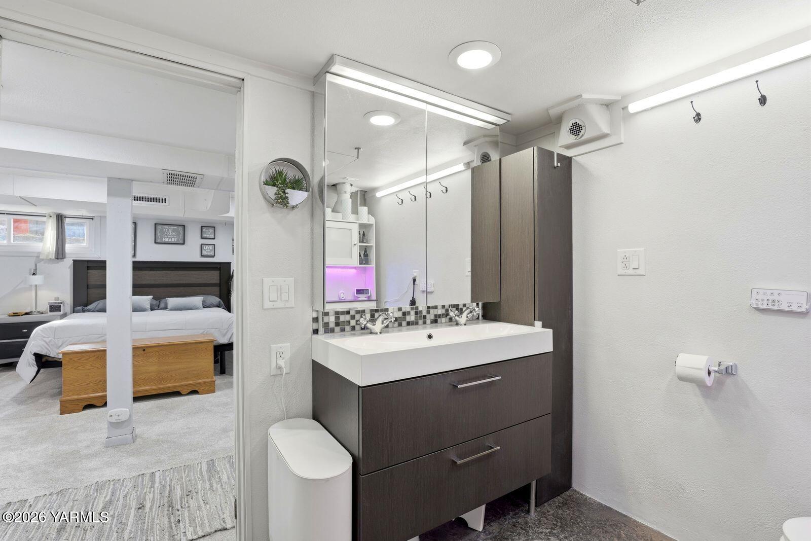 3208 Summitview Avenue Yakima, WA 98902 - Photo 19 of 26 a bathroom with a sink vanity tub shower and a mirror