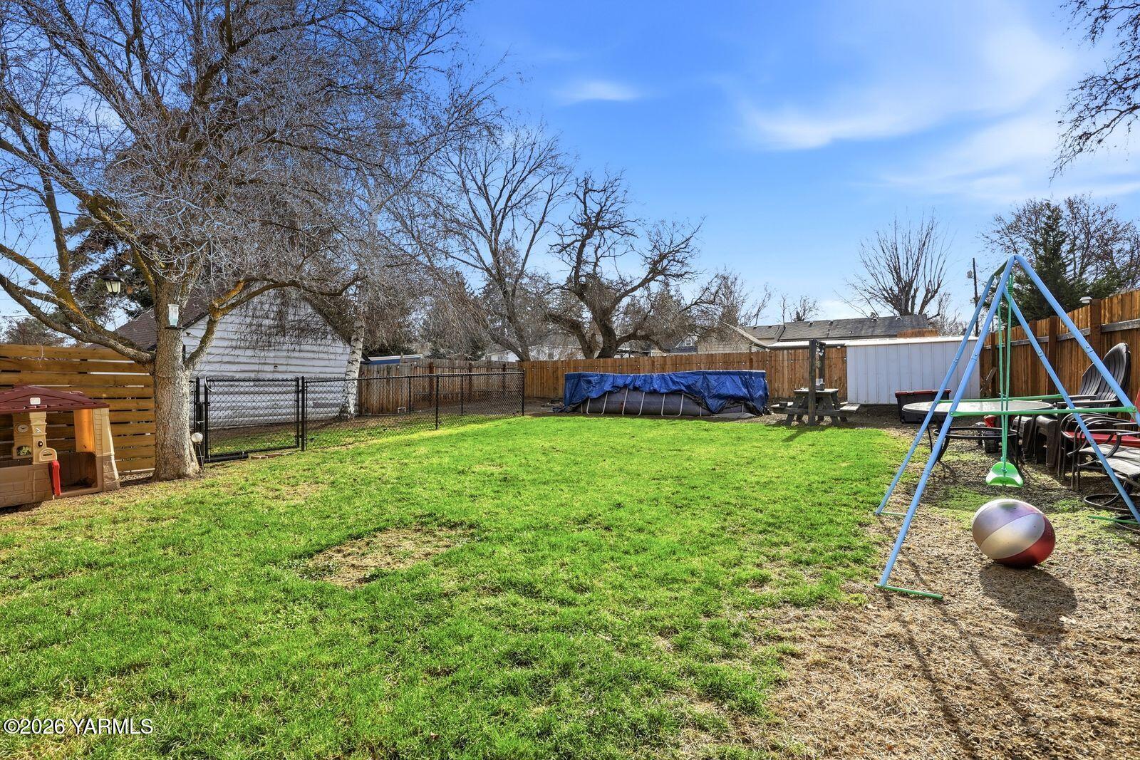 3208 Summitview Avenue Yakima, WA 98902 - Photo 6 of 26 a view of a house with a backyard