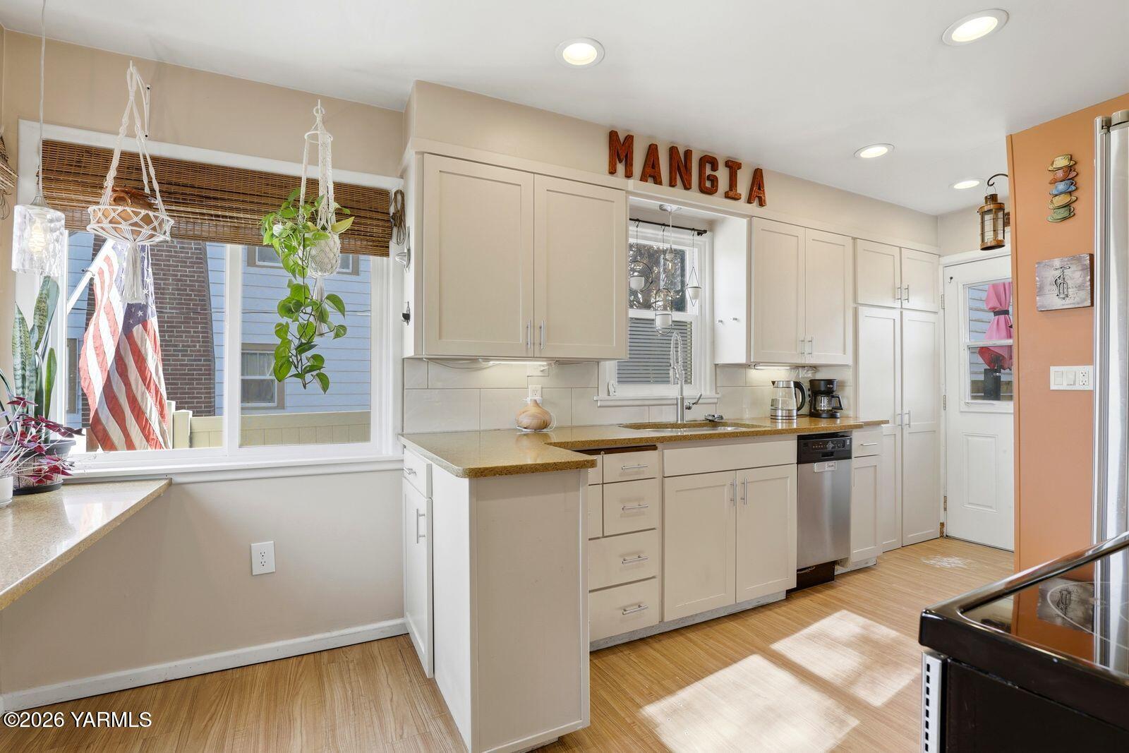3208 Summitview Avenue Yakima, WA 98902 - Photo 10 of 26 a kitchen with white cabinets and window