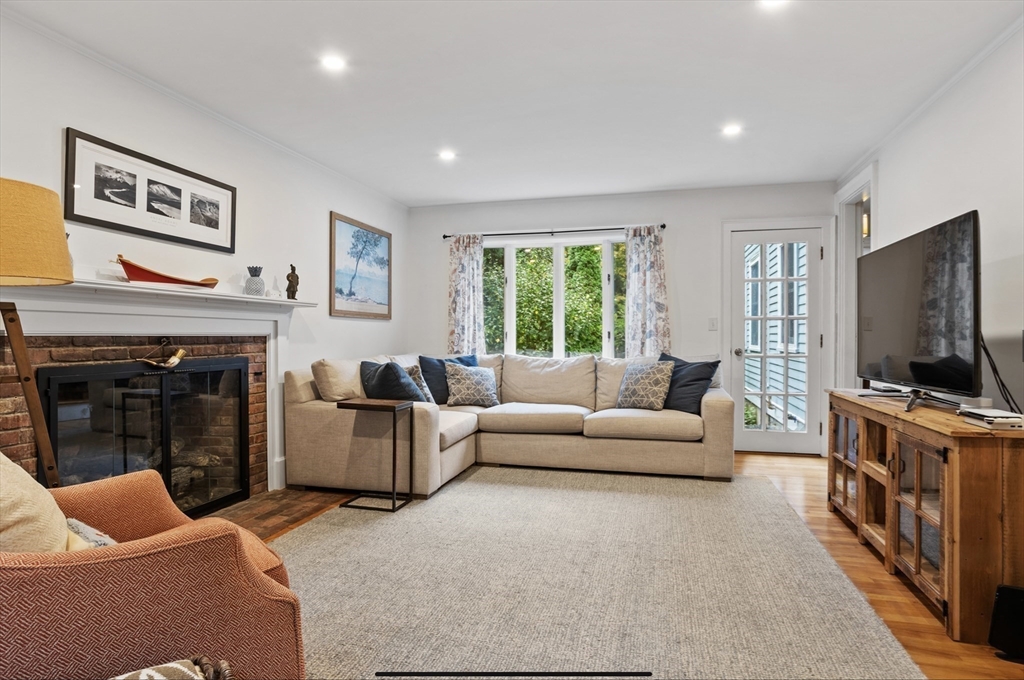 45 Walnut Road Hamilton, MA 01982 - Photo 12 of 40 a living room with furniture a flat screen tv and a fireplace