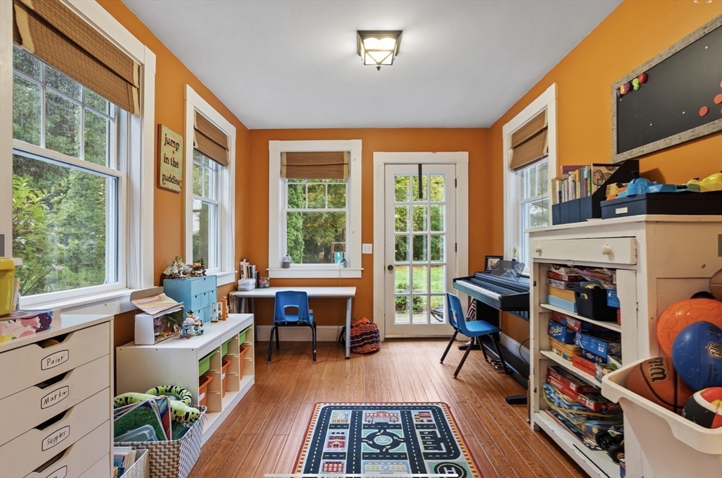 45 Walnut Road Hamilton, MA 01982 - Photo 20 of 40 a living room with furniture and a floor to ceiling window