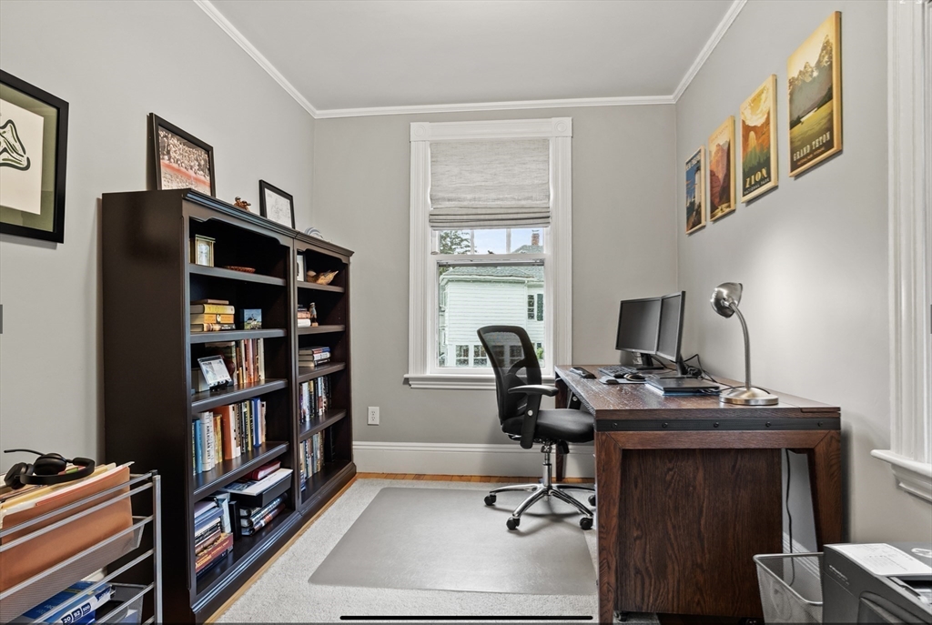 45 Walnut Road Hamilton, MA 01982 - Photo 21 of 40 a view of a workspace with furniture and a bookshelf